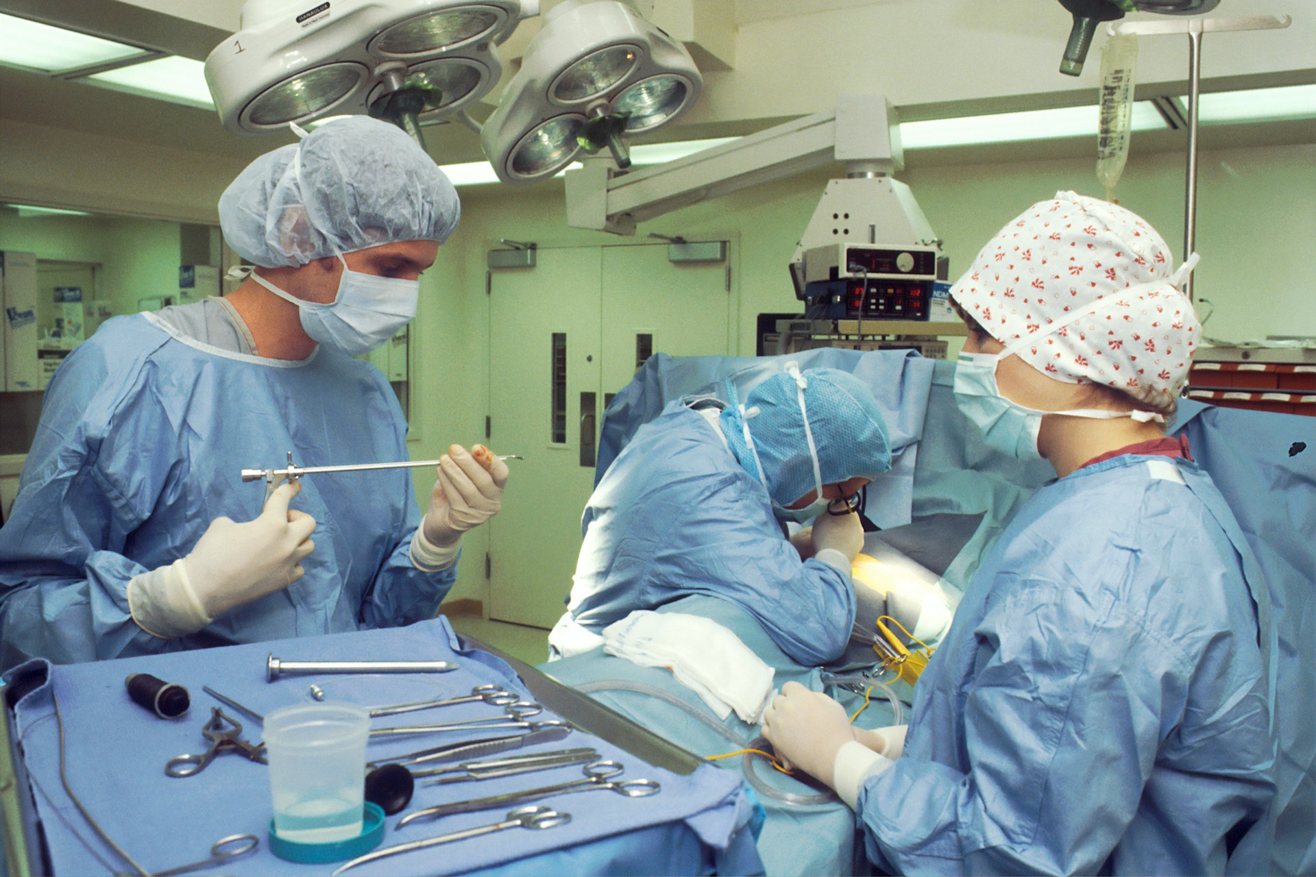 people in blue scrub suit sitting on chair